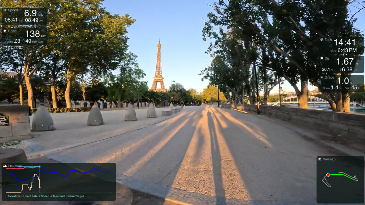 TerraFlo route playback: a golden-hour Paris run toward the Eiffel Tower with live overlays for speed, heart rate, time, distance, grade, elevation, and minimap